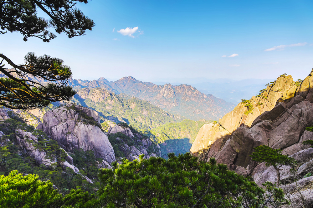 Explore Huangshan (Yellow Mountain) in China’s Anhui Province, famous for its dramatic granite peaks, ancient pine trees, hot springs, and breathtaking mist-filled landscapes