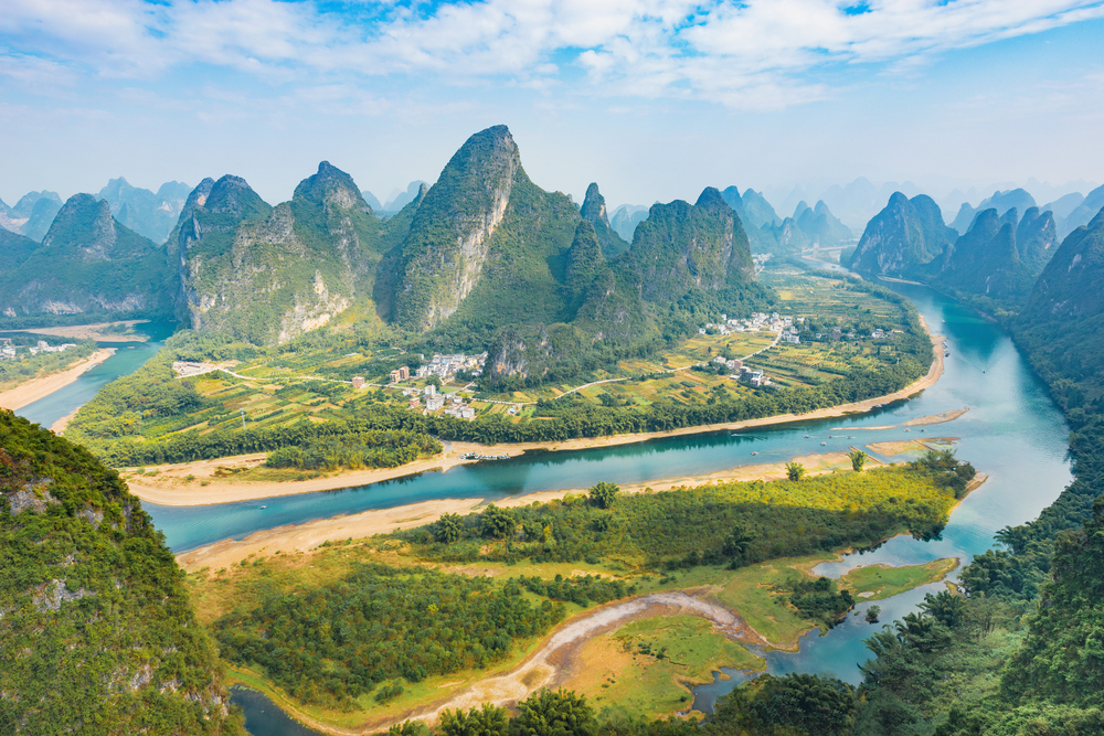 Explore the Li River in Guangxi, China, famous for its breathtaking karst mountain landscapes, crystal-clear waters, and picturesque limestone peaks that have inspired centuries of art.