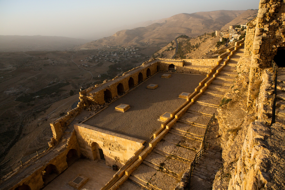 Explore Kerak, Jordan, known for its historic Crusader Castle, offering breathtaking views over the surrounding valleys and rich cultural heritage dating back to ancient times