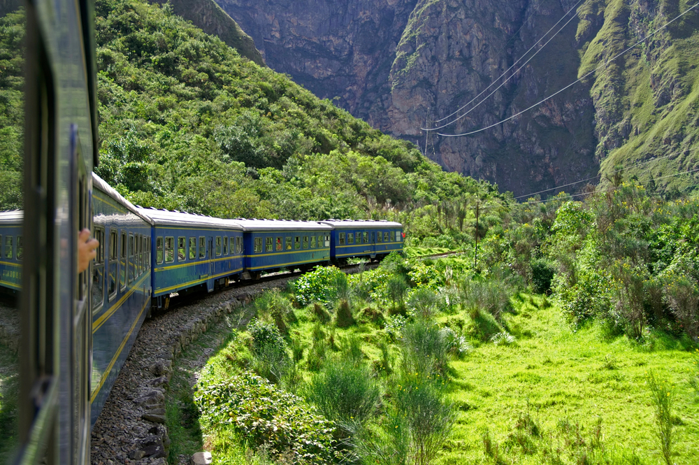 Enjoy a scenic panoramic train ride to Machu Picchu, offering breathtaking views of the Andean mountains and the Sacred Valley