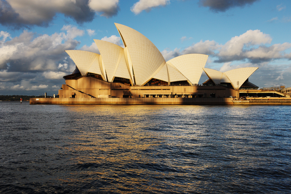 Interior view of the Sydney Opera House with a guide leading a small group through the concert hall, Sydney, Australia