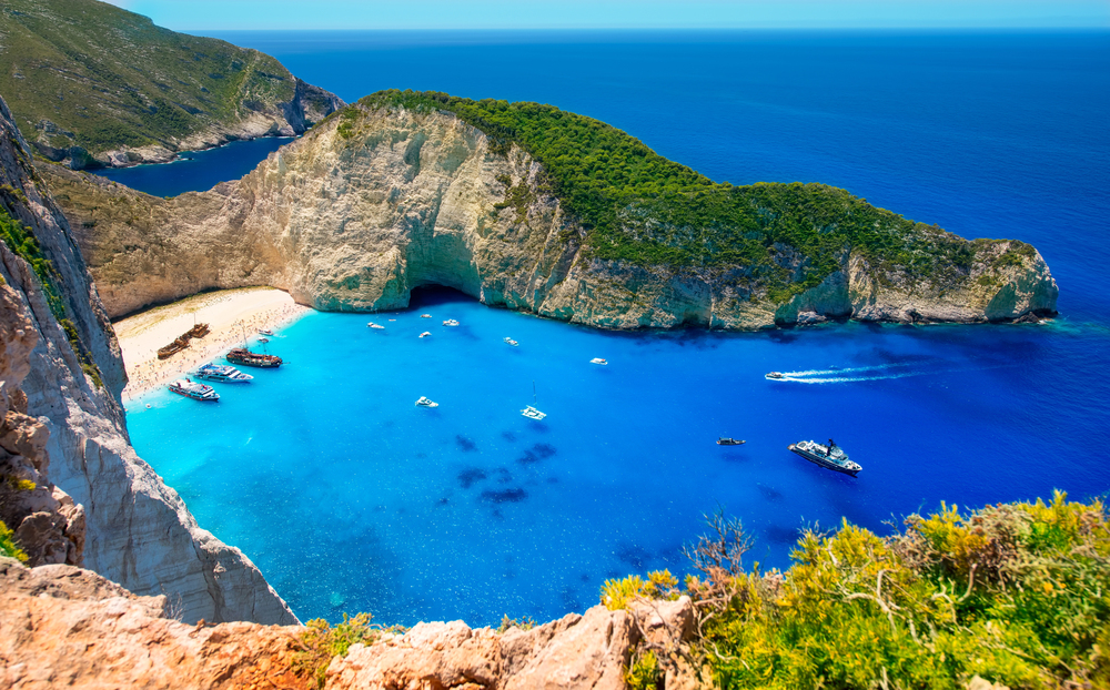 Aerial view of Navagio (Shipwreck) Beach with turquoise water and dramatic cliffs on Zakynthos island, Greece