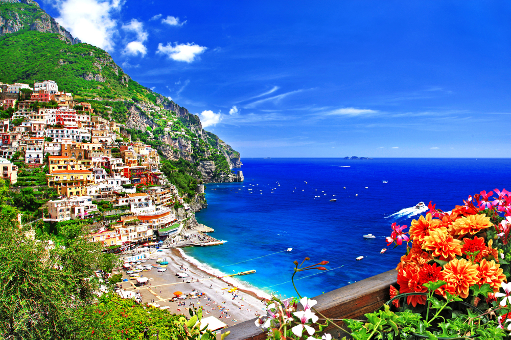 View of Positano’s colorful cliffside buildings overlooking the sea along Italy’s Amalfi Coast