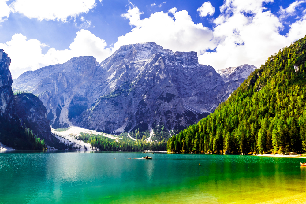 Lake Braies in the Dolomites with turquoise water, wooden boats, and dramatic mountain peaks in northern Italy